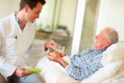 doctor gives a pill for prostatitis